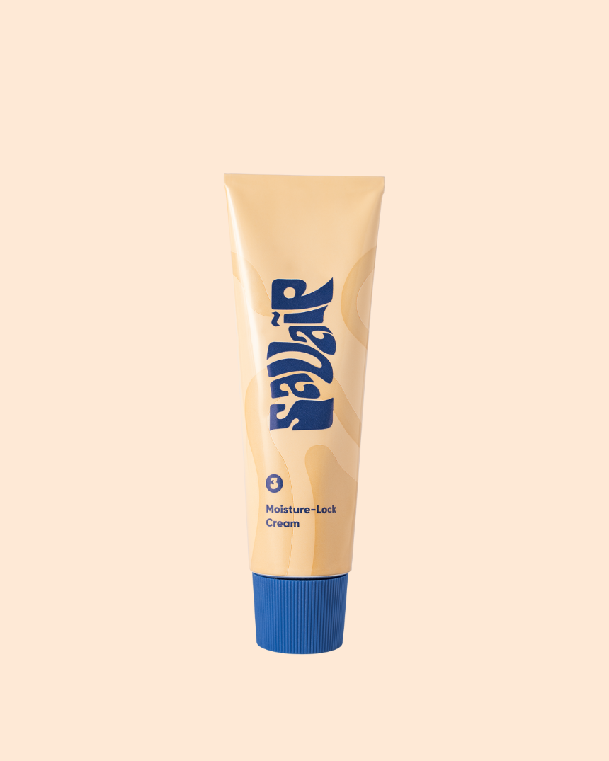 A Savaip Skin beige skincare tube with bold blue typography, labeled as "Moisture-Lock Cream". The tube features a vibrant blue cap.